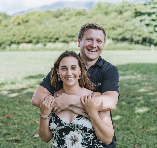 Justin Lewis outdoors, pictured with a companion