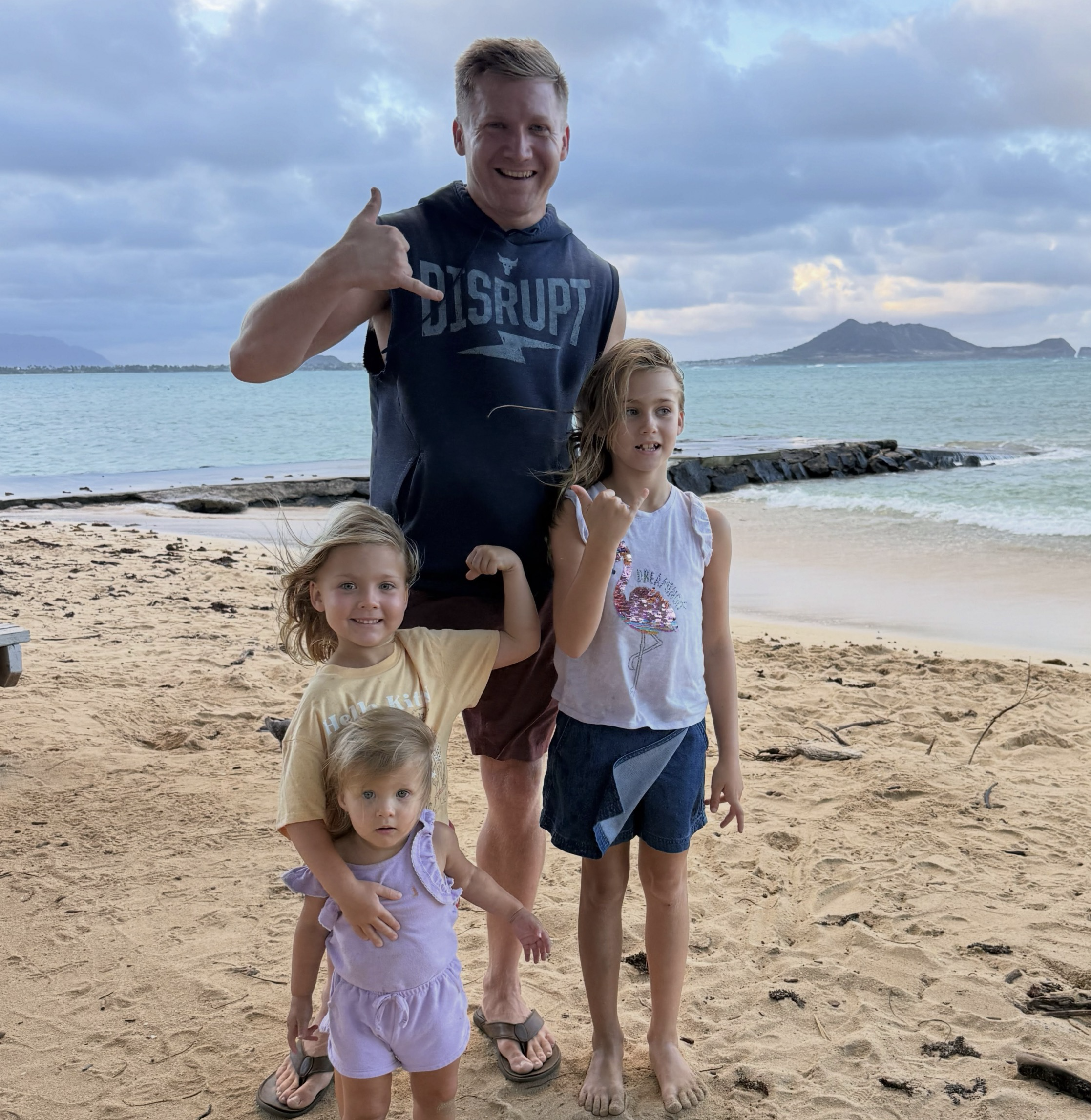 Justin Lewis with family at the beach
